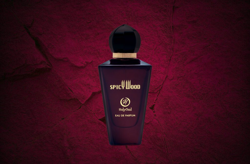 A bottle of Spicy Wood By Holy Oud in dark mehroon color
