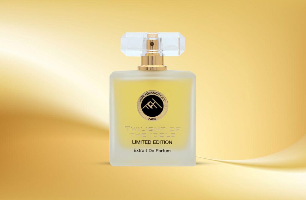 A yellow-golden bottle of Twilight Of Idols By The Fragrance House