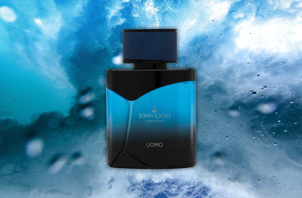 A bluish-black bottle of Uomo Eau De Parfum By John Loewe
