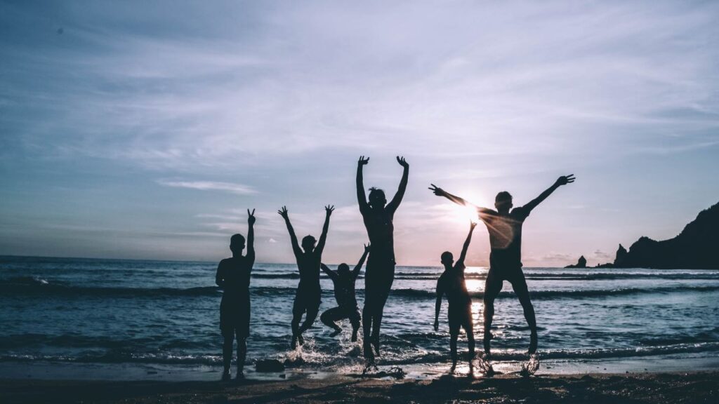 kids playing at the beach on an evening