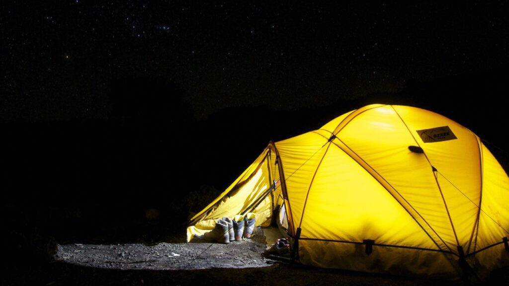 yellow coloured camping tent at night