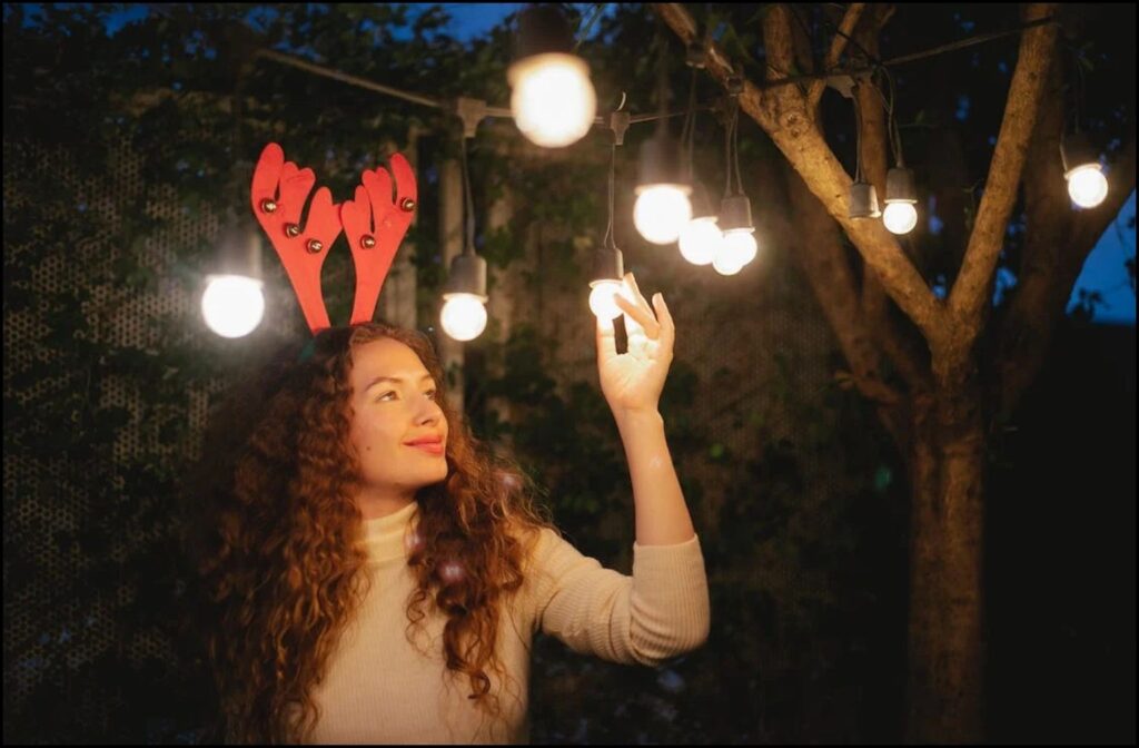 A woman decorating for Christmas event