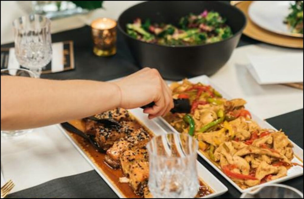 A photo of a person, eating Potluck
