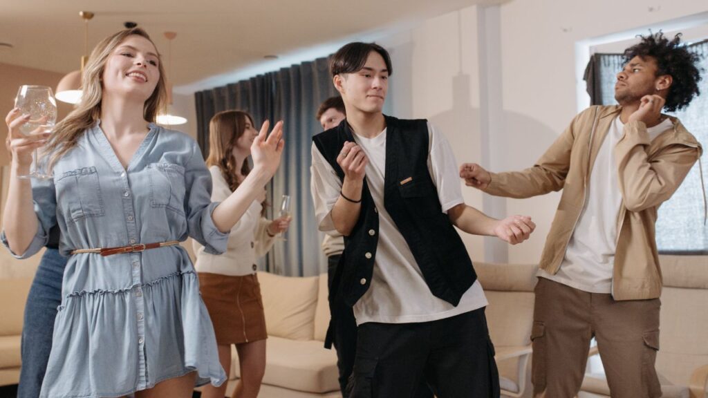 image of a group of friends singing and dancing together