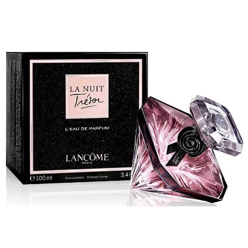 Pink and black Lancome Tresor perfume next to its package.