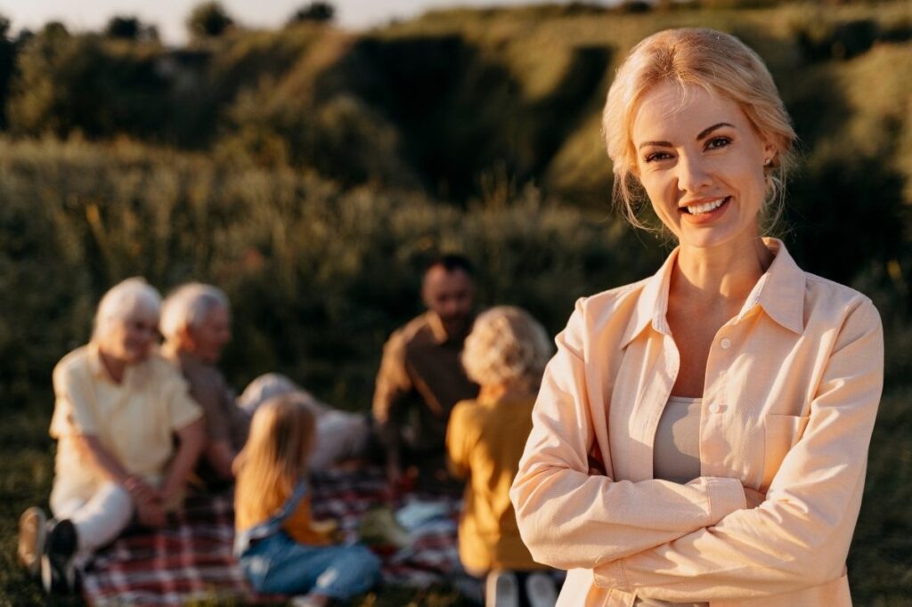 An image of a mom with her family whle on a family outing