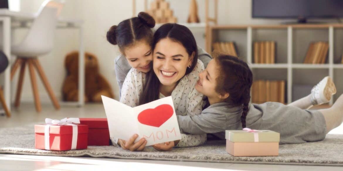 An image of a mother with her children with their mothers day gifts