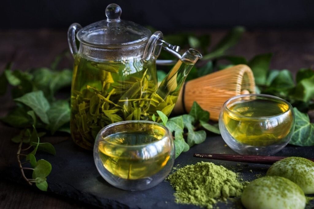 Foods That Make Your Body Odor Good 21 An image of a jug filled with green tea