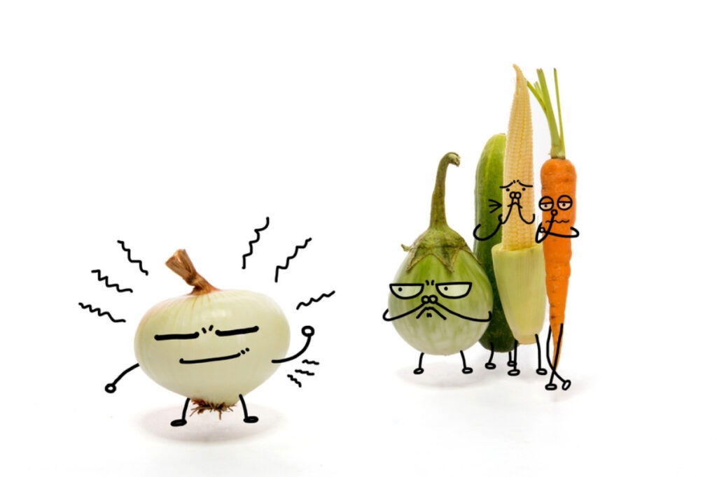 Foods That Make Your Body Odor Good 18 A creative illustration of different vegetables in which other vegetables are avoiding onion as a comic