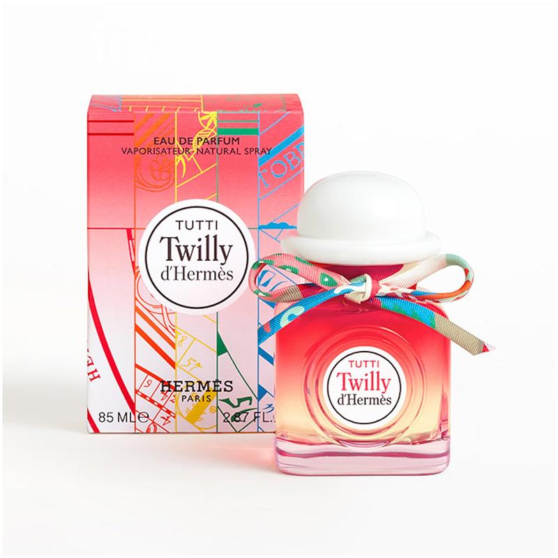 an image of Hermes tutti twilly perfume bottle with a tie on the perfume top and a hat