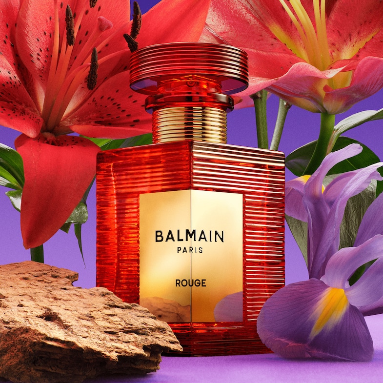 An image of Balmain rouge perfume bottle in red