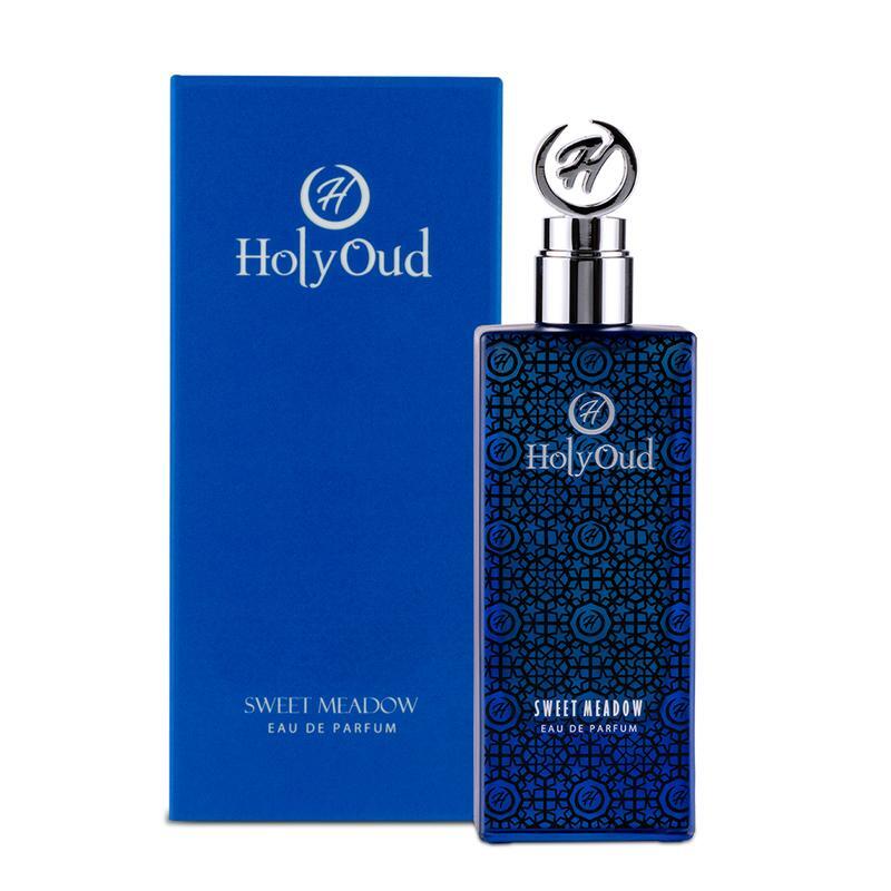 An image of Holy oud sweet meadow perfume in blue color with its box