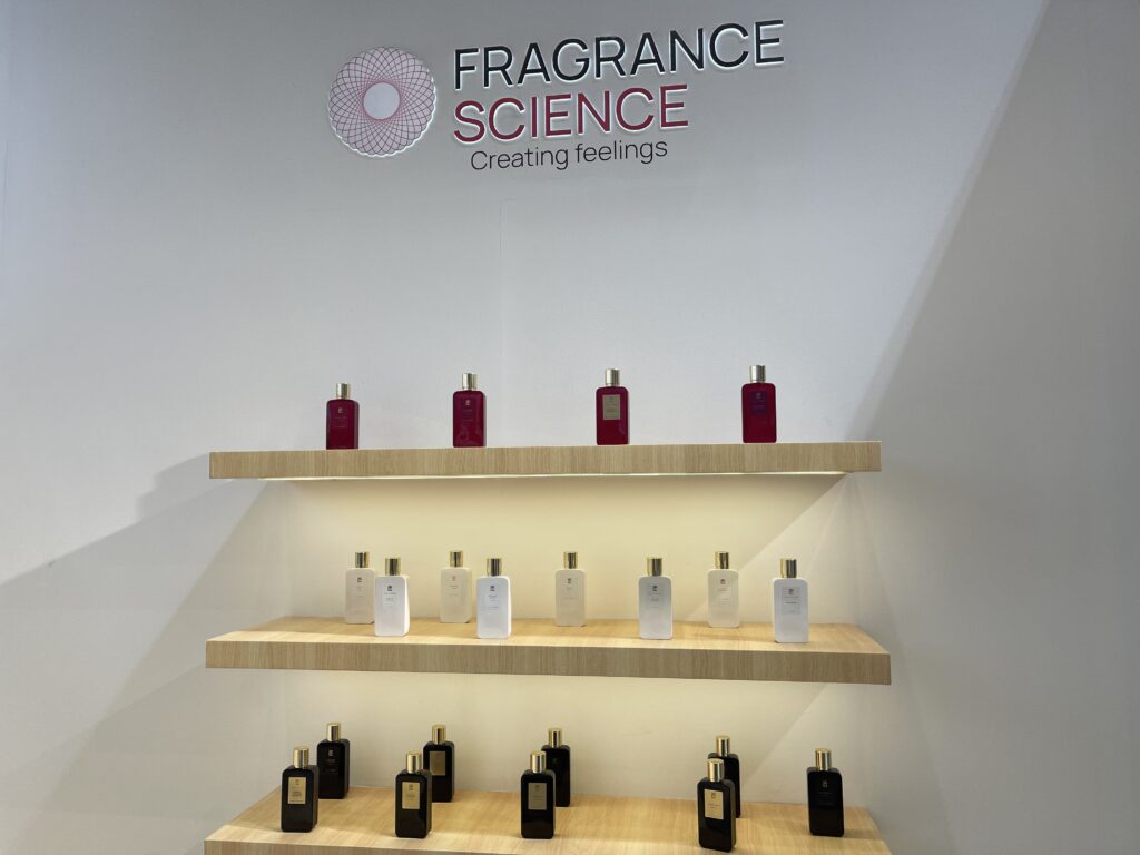 An image of a perfume startup that has different perfumes placed on a wall podium.