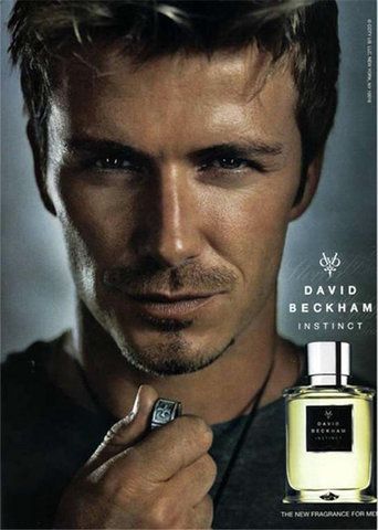 5 Football Stars Who Won the Fragrance Game 25 In this image David Beckham exudes confidence and sophistication in this close-up shot, holding a necklace pendant while gazing intensely into the camera. Beside him is a bottle of "David Beckham Instinct" fragrance, elegantly presented with the tagline "The New Fragrance for Men."