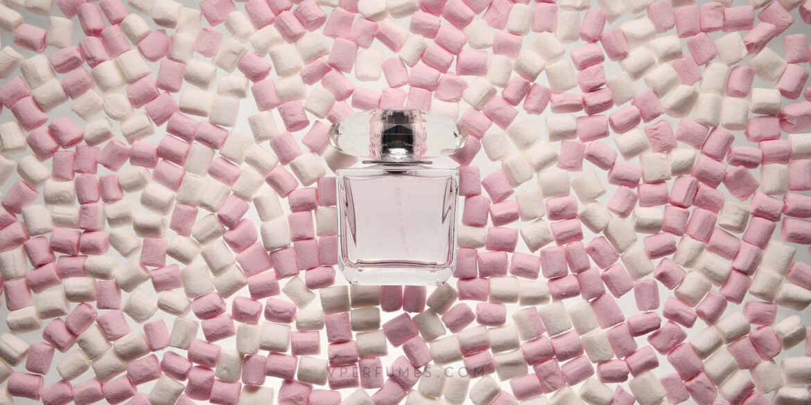 An image of a perfume in the middle of a floor with a lot of marshmallows