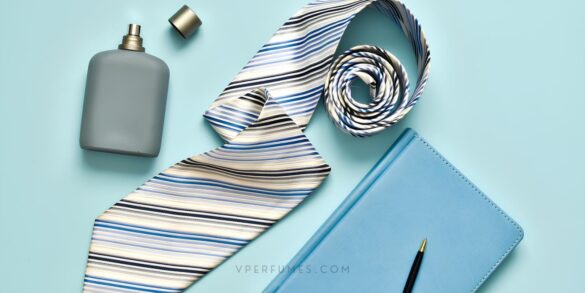 Une image d'un parfum, d'une cravate et d'un livre avec un stylo, symbolisant une ambiance de bureau