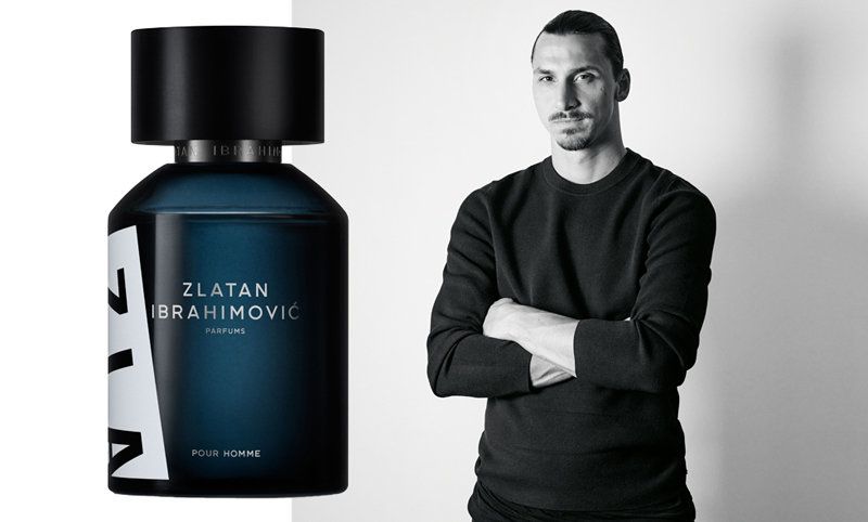 5 Football Stars Who Won the Fragrance Game 31 In this image Zlatan Ibrahimović stands confidently in a sleek and stylish outfit, exuding charisma and power. The backdrop is minimalistic yet bold, highlighting his commanding presence. Beside him, a bottle of his signature fragrance, "Zlatan Ibrahimović Parfums," is prominently displayed, symbolizing elegance and individuality.