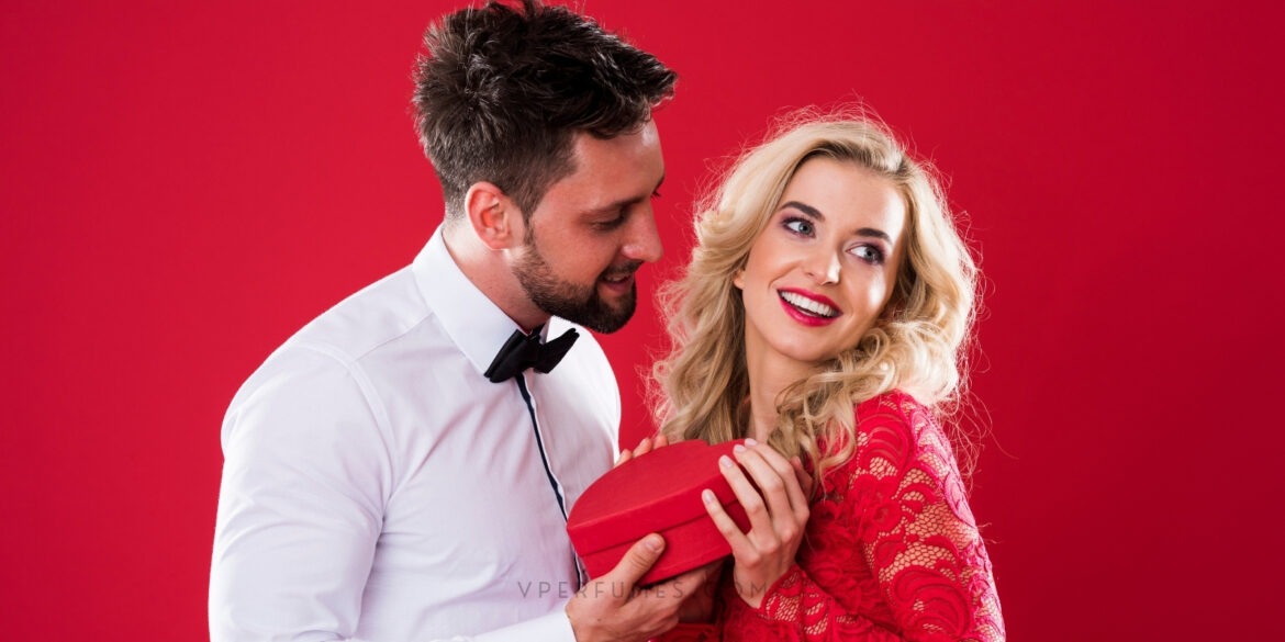 An image of a couple with a gift box in their hands