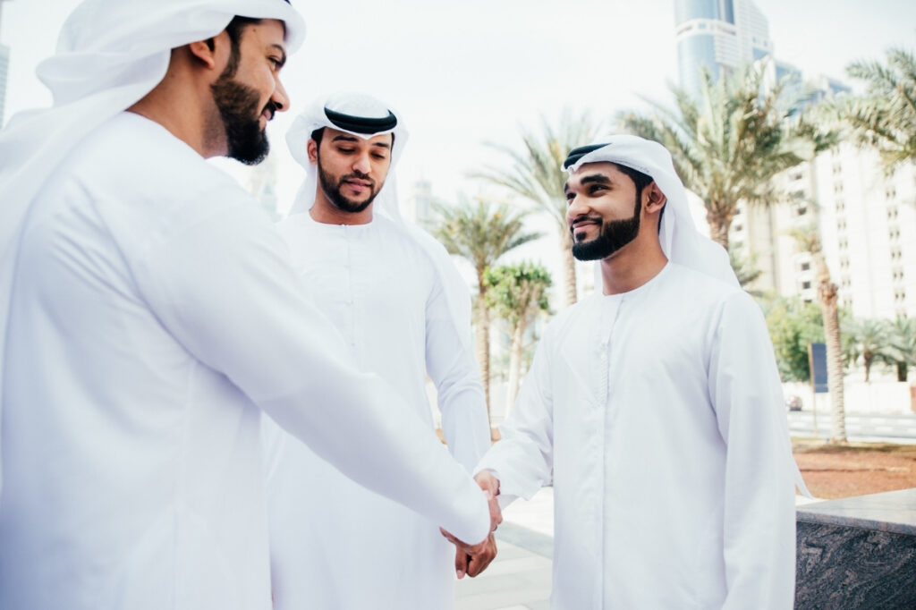 An image of a group of friends wishing eid mubarak.