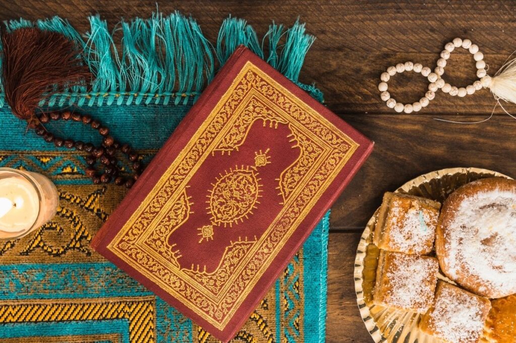 How to Pick the Perfect Ramadan Gift for Everyone 18 An image of quran with a prayer mat and beads lying next to it.