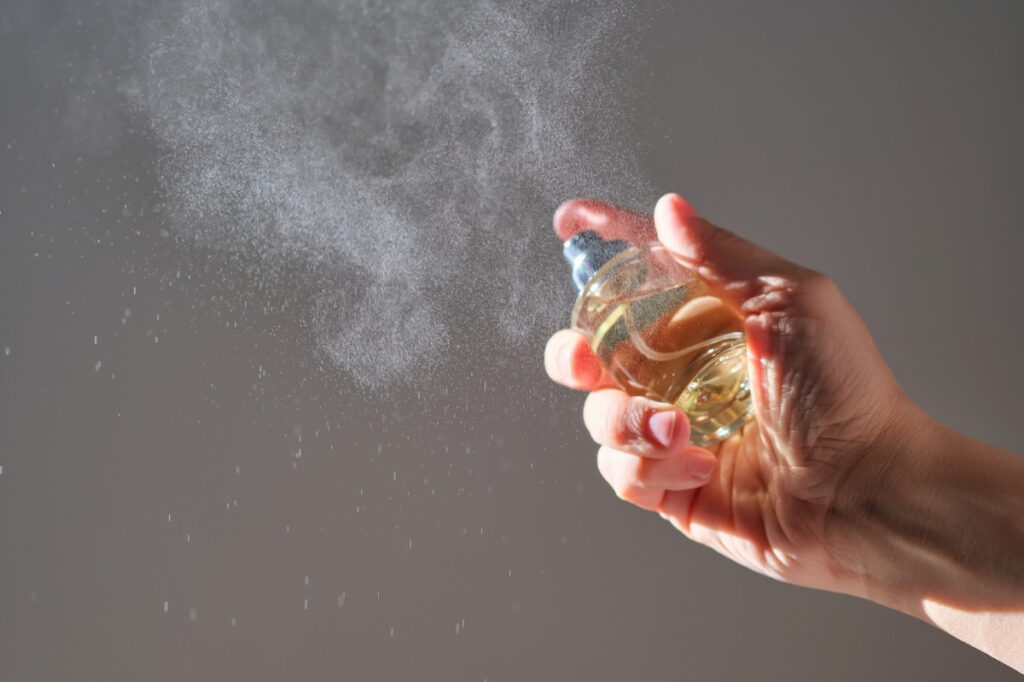 Does Perfume Expire & Does The UAE Heat Affect That? 20 An image of a hand spraying perfume