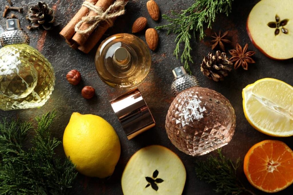 An image of a perfume and different ingredients of the same