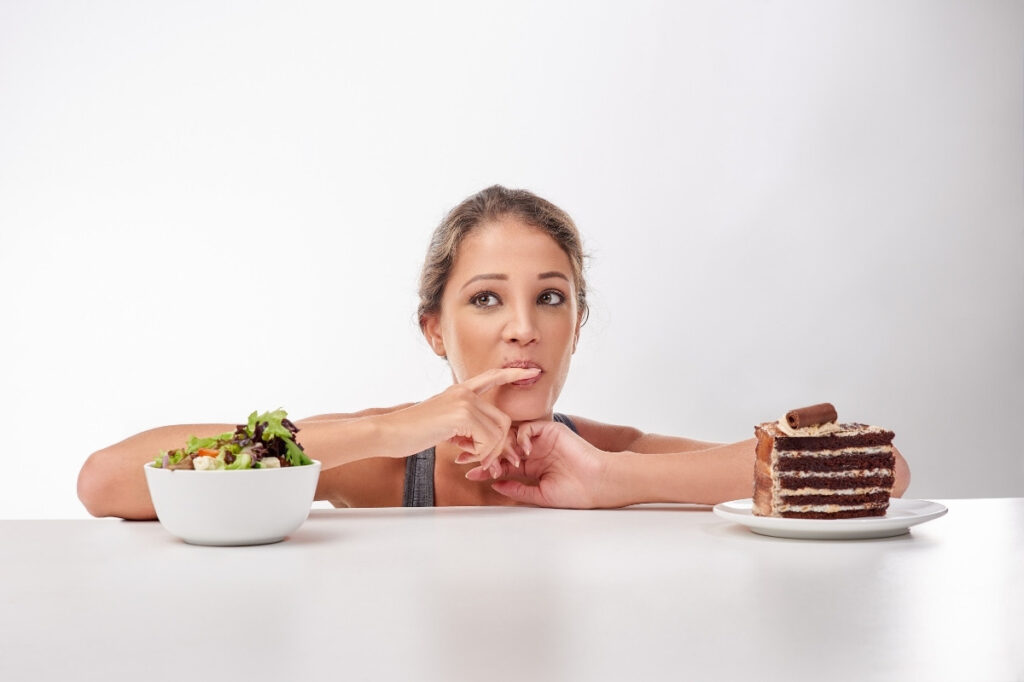 An image of a woman tasting different foods