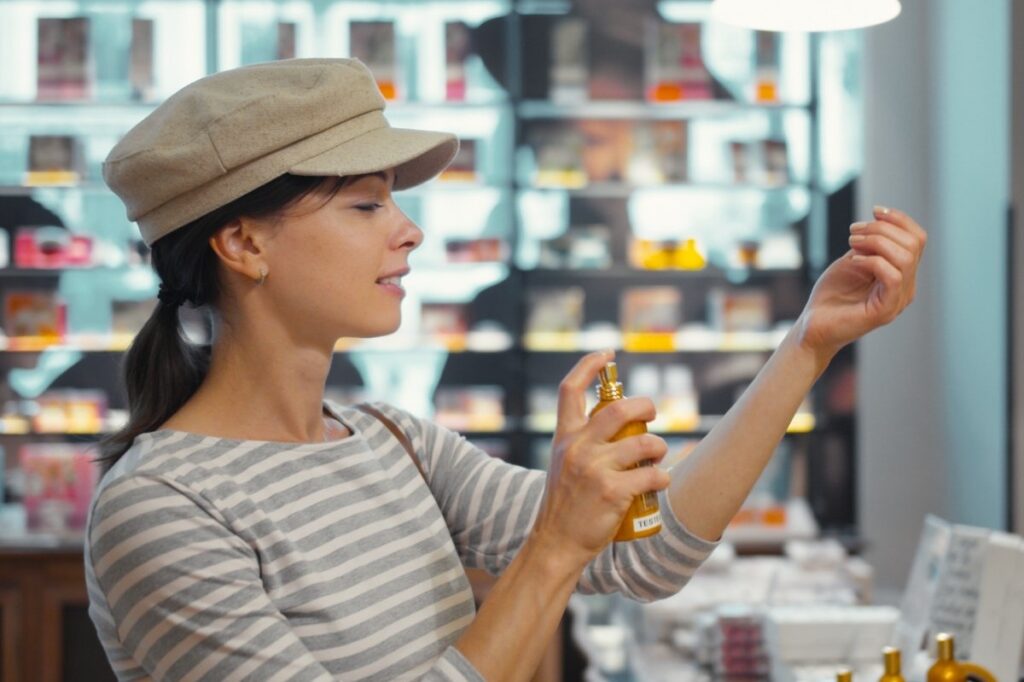 Image of a woman trying out different perfume
