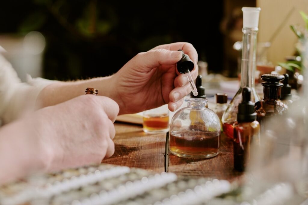 An image of a person mixing alcohol in perfume