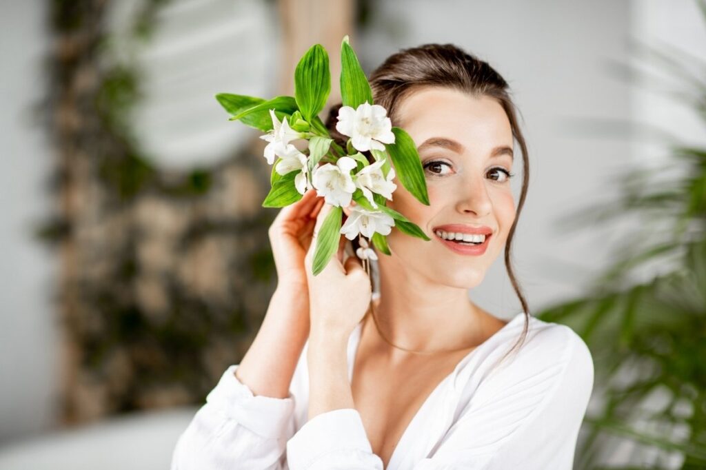 The Best Smelling Flowers Found In Perfumes 23 A woman with tuberose flower in her hand