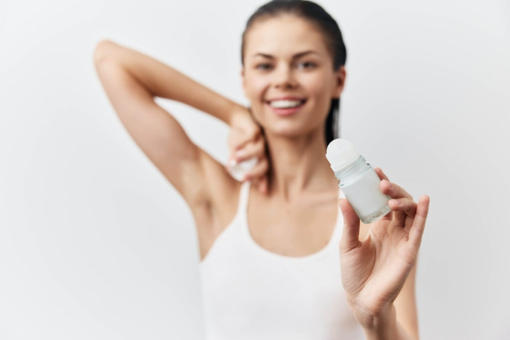 An image of a girl with deodorant