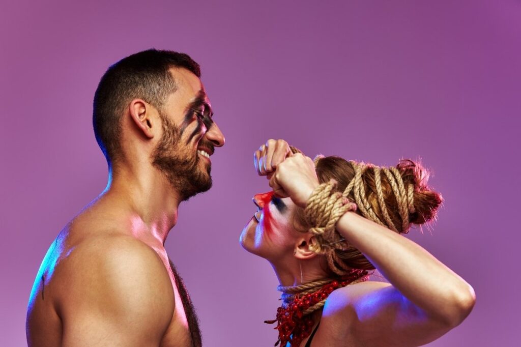 An image of a man and woman who are gymnasts attracted to each other