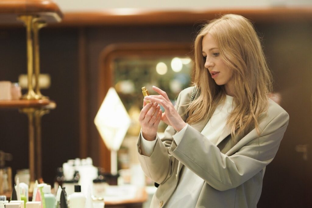 Are Perfume Testers Really Better Than the Ones You Buy 22 An image of a woman checking out a perfume