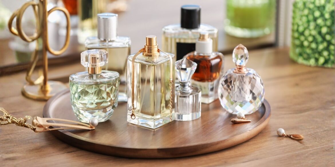 An image of different french perfume botles placed over a table top