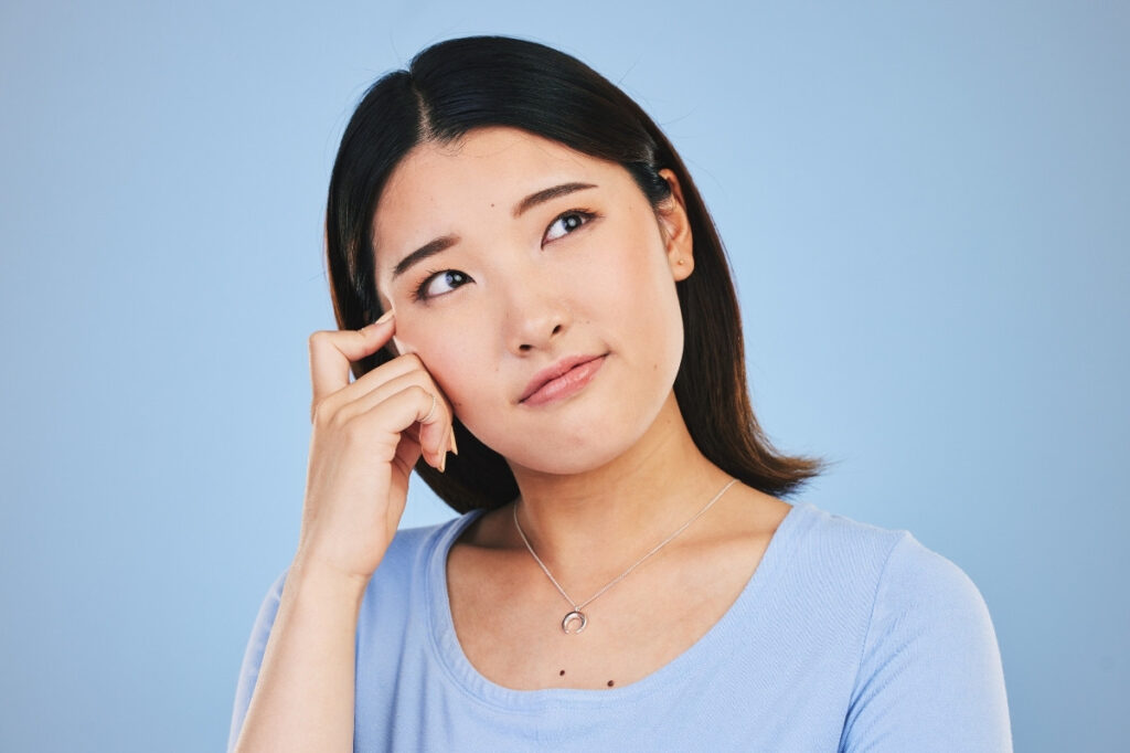 The Gourmand Switch From Sweet to Savory: The Next Fragrance Trend 20 A woman thinking about something