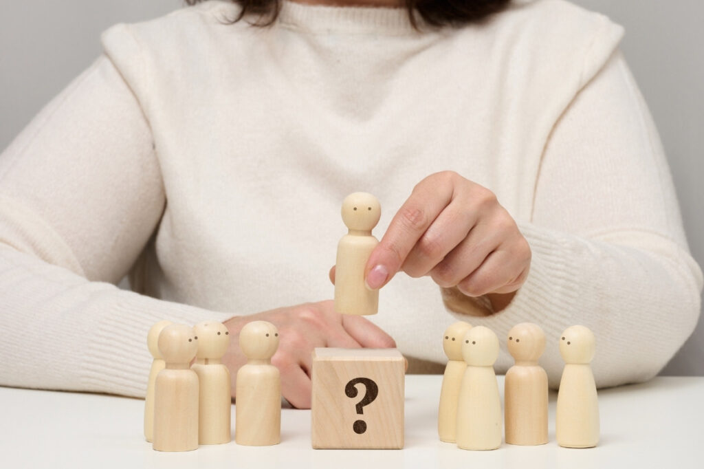 A Blind Sniff Test - Do you know your fragrances? 18 An image of a woman who is keeping the red wooden figurine separate from the rest