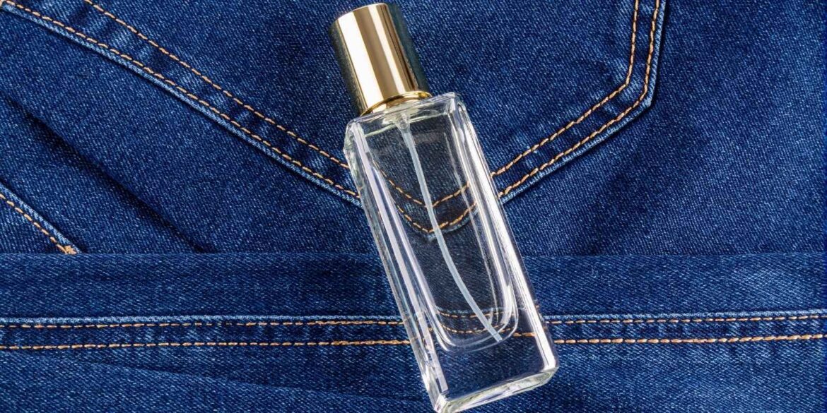 An image of a perfume bottle above a cloth