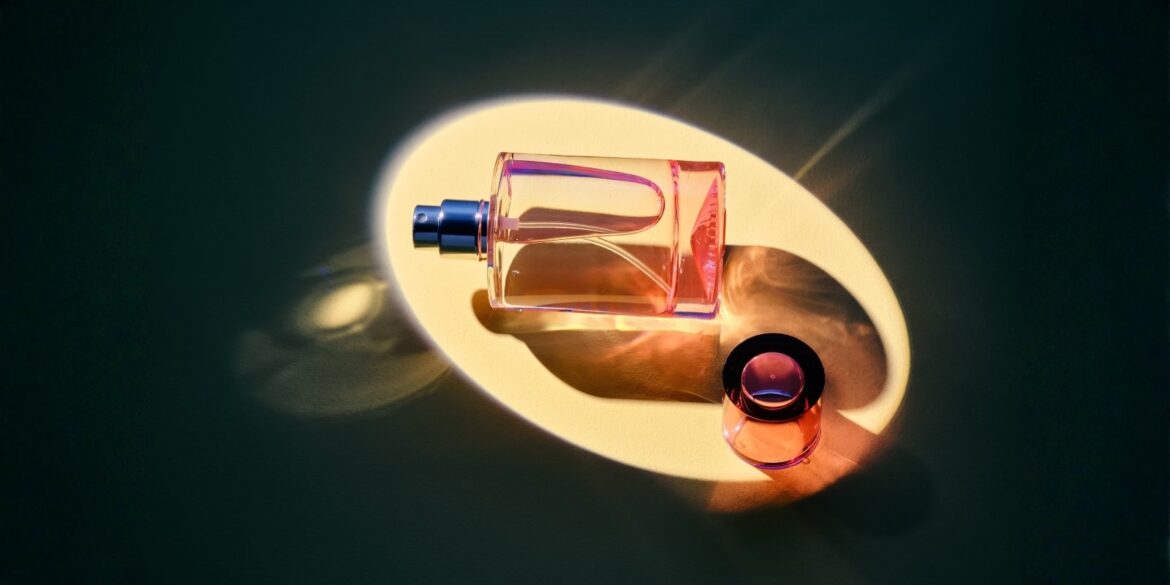 An image of a perfume under a sppotlight